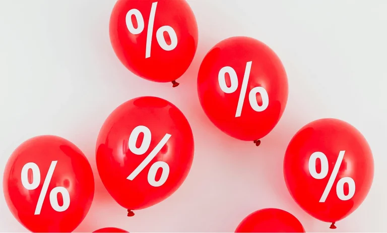 Red balloons with white percentage sign